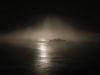 A sepia-toned photo of Alcatraz shrouded in fog