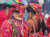 A photograph of indigenous people in bright garb