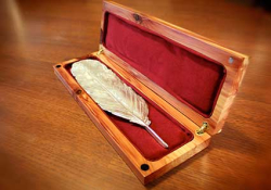 A photo of the Neustadt Prize silver feather