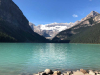 Snow-capped mountains frame a lake