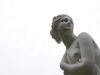 A cropped photo of a Greek statue against a white background