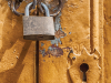 Padlock on a rusted door