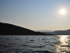 A photograph of a sunrise over the waters off of Ithaca in Greece