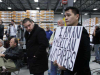 Jose Antonio Vargas holds a sign at a Mitt Romney presidential campaign rally in 2011 in a scene from his film “Documented.” Photo courtesy of Apo Anak Productions.