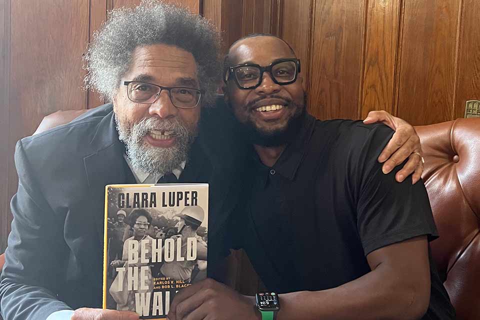 A photograph of Dr. Cornel West with interviewer Karlos K. Hill